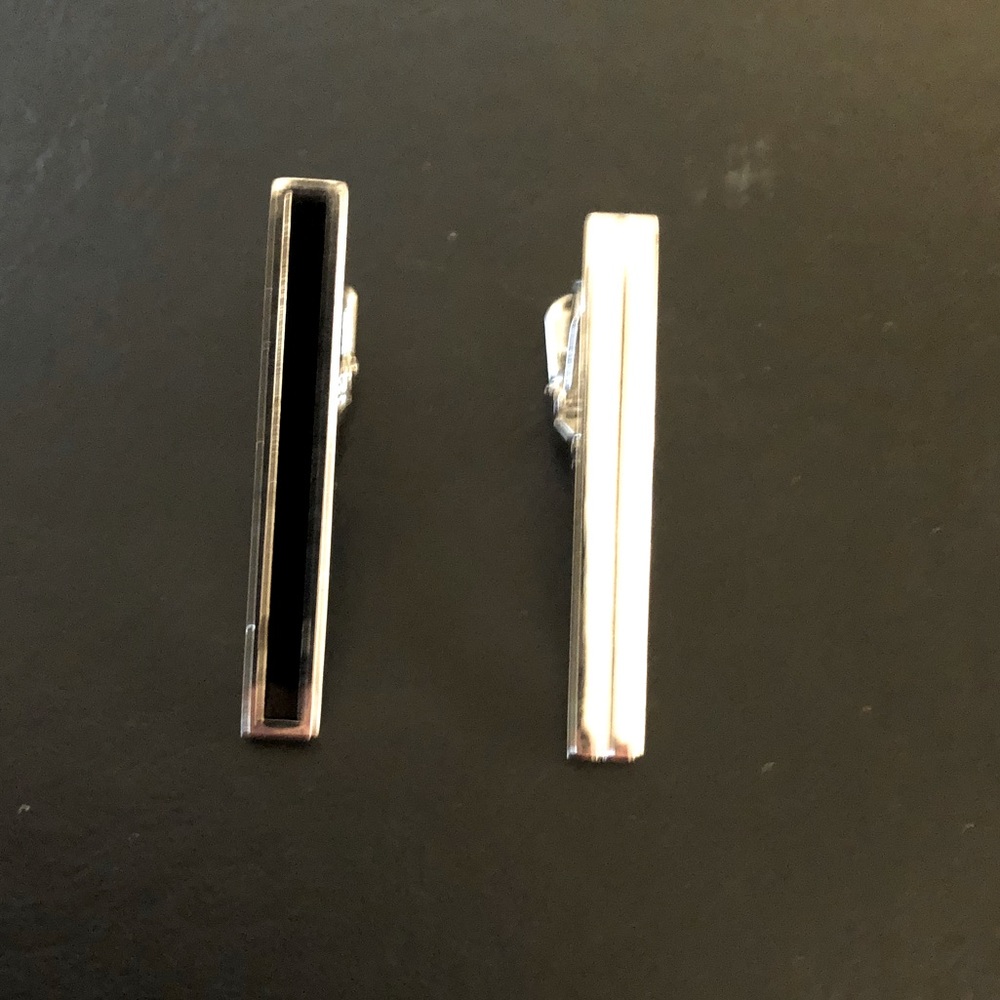 Silver and black tie clips